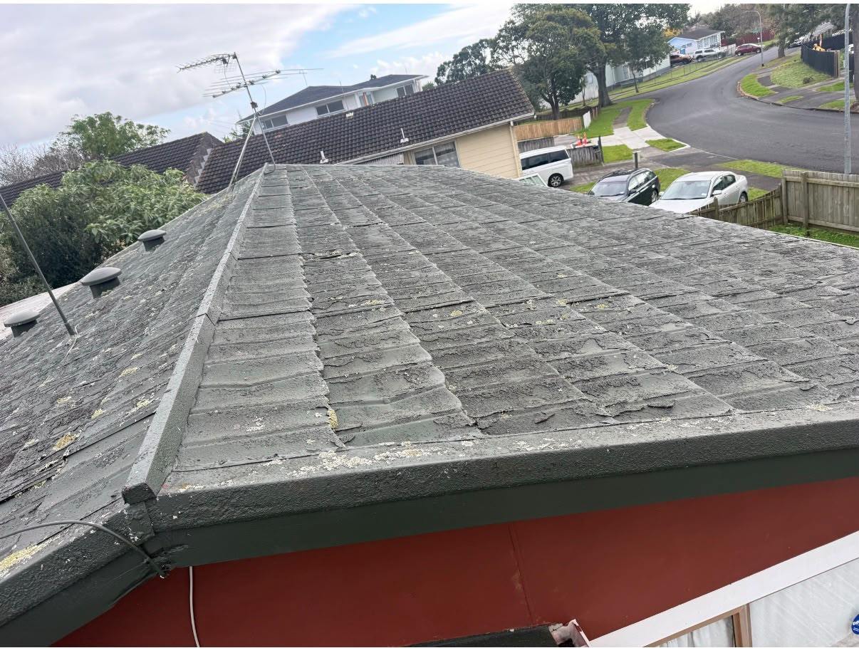 The ridge of the old decramastic roof, weathered and streaked