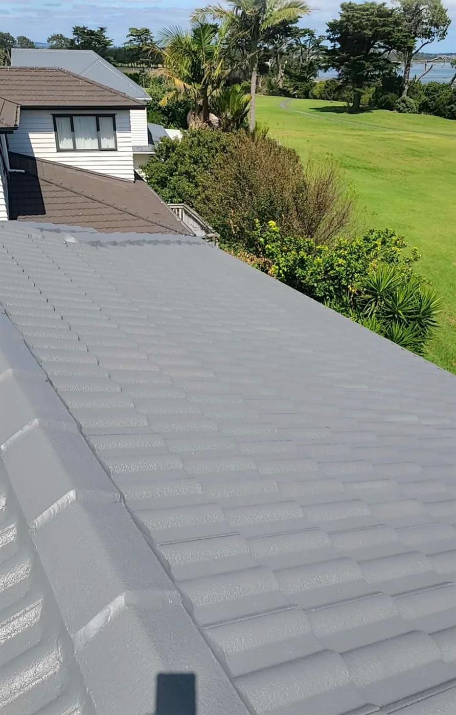 A restored concrete tile roof on a coastal Auckland property